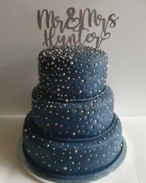 Navy 3 tiered cake with silver decoration