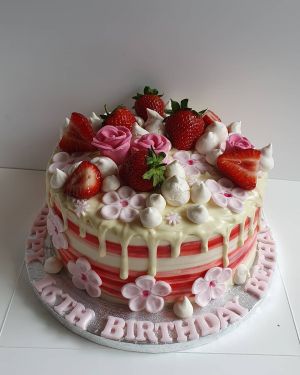 White choc drip, strawberries & flowers