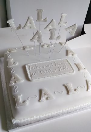 White initials wedding cake